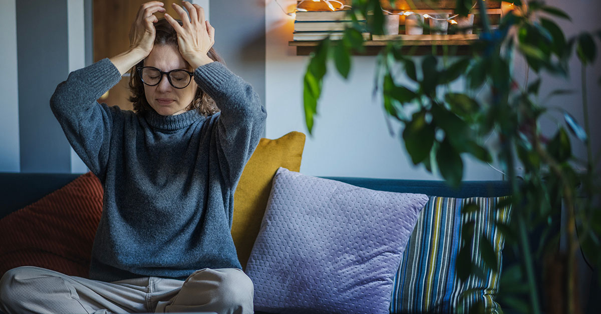 Woman suffers a migraine