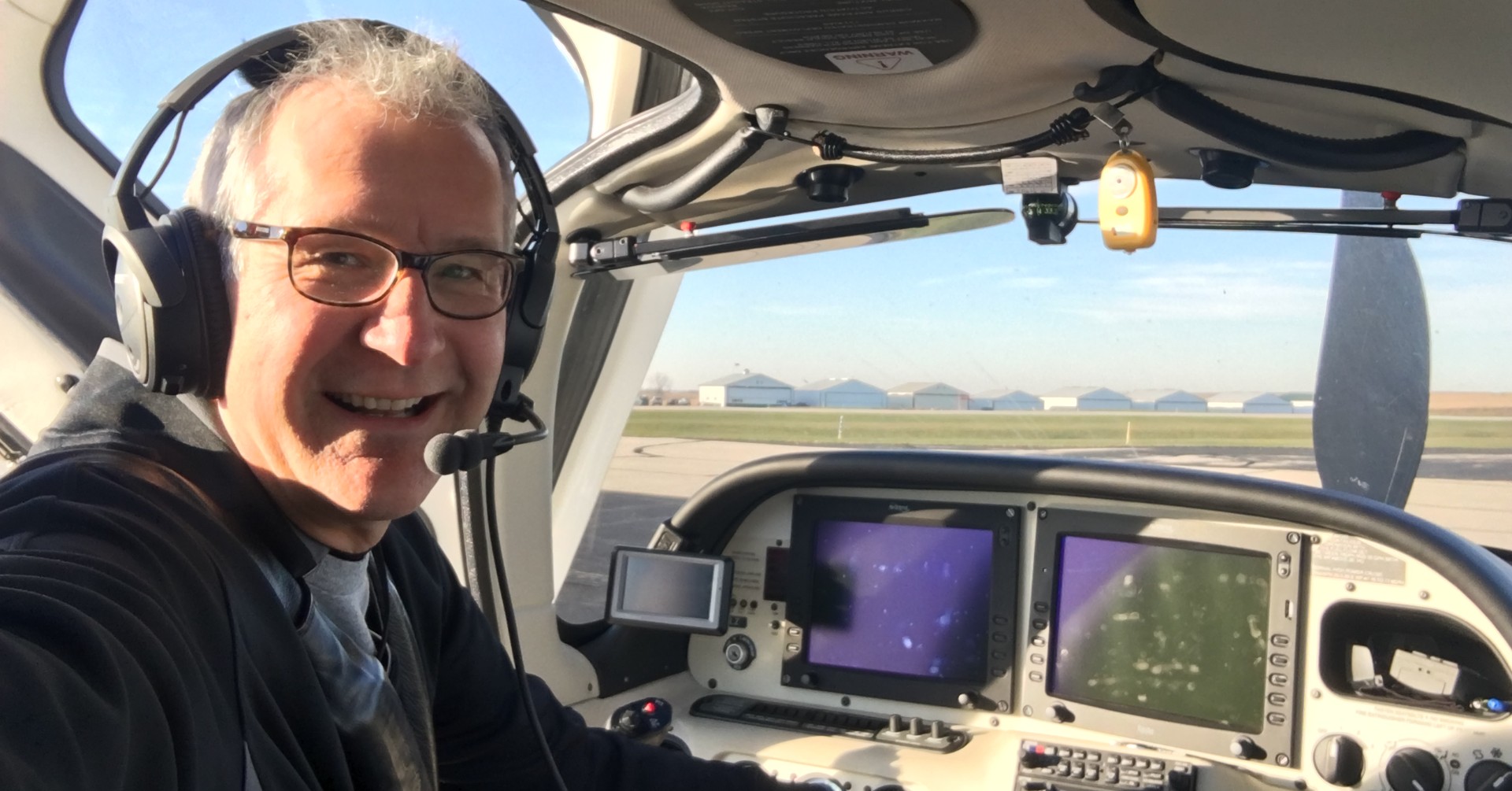 Dr. Kevin Wienkers of BayCare Clinic sits in the cockpit of a small plane