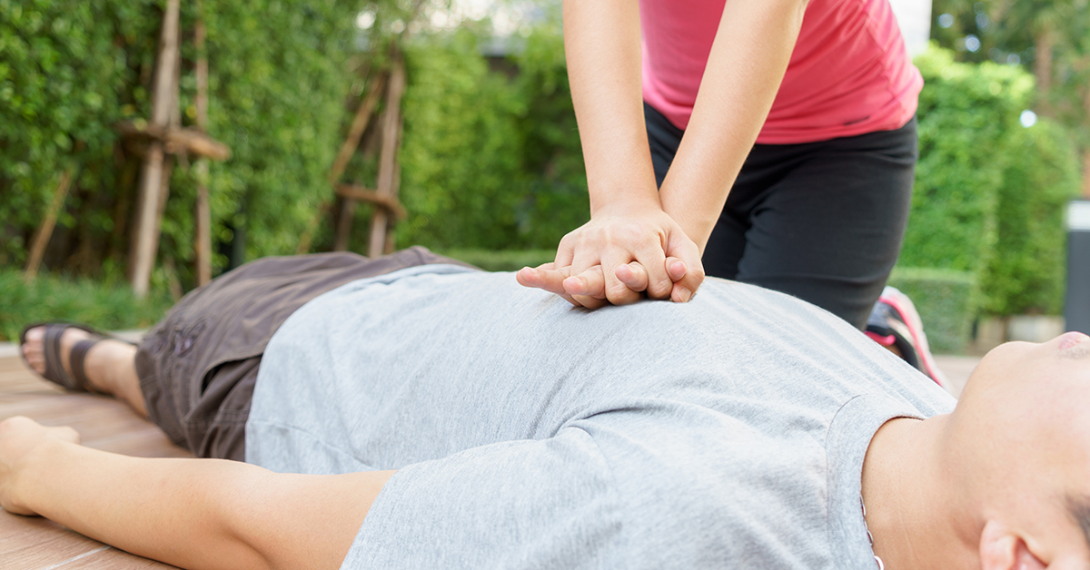 Patient on ground receiving compression-only CPR