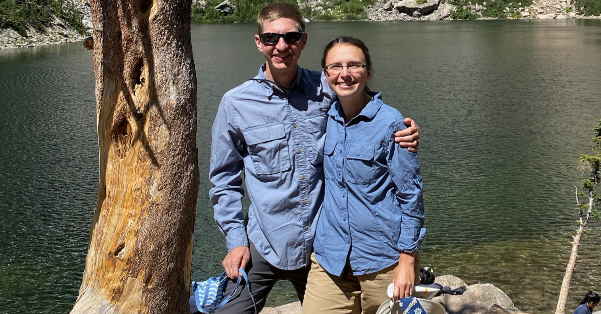 Dr. Joshua Piotrowski of Aurora BayCare Urological Surgeons and his wife, Bethany, pose for an outdoors picture.