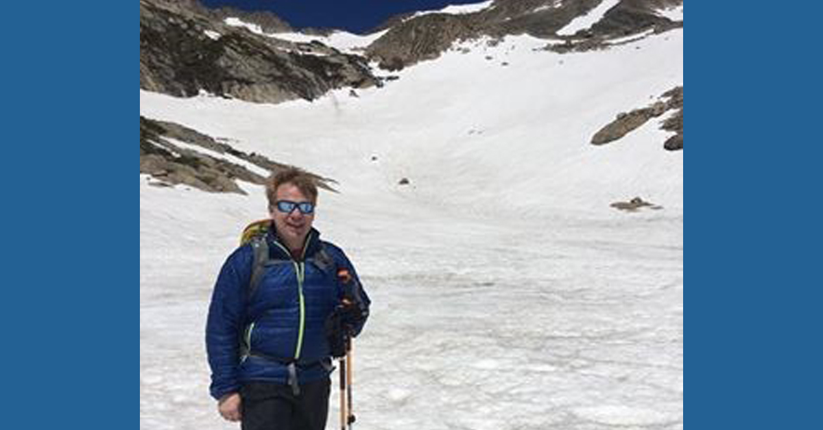 Dr. Richard Harrison, BayCare Clinic, poses in front of a snowy landscape