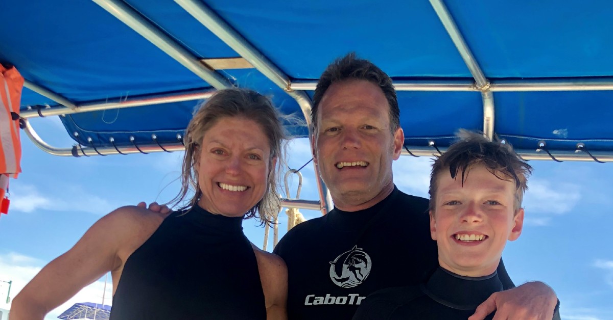 Dr. Kara Harbick, a glaucoma specialist with BayCare Clinic Eye Specialists, poses on a boat with her husband and son