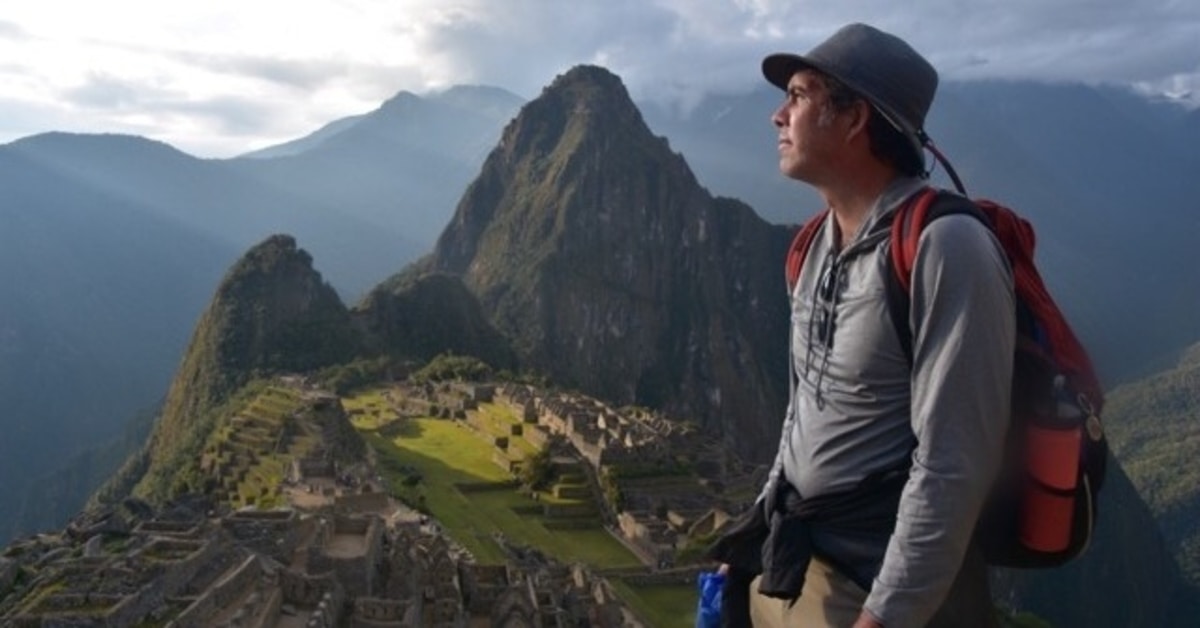 Dr. Stephen Brada, anesthesiologist with BayCare Clinic, poses with mountains in the background.